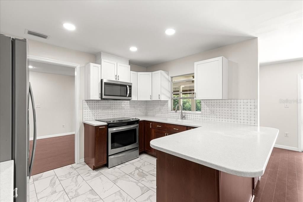 Interior, Kitchen, Marble, Recessed Lighting, Stainless Steel Appliances, Wood Texture Flooring
