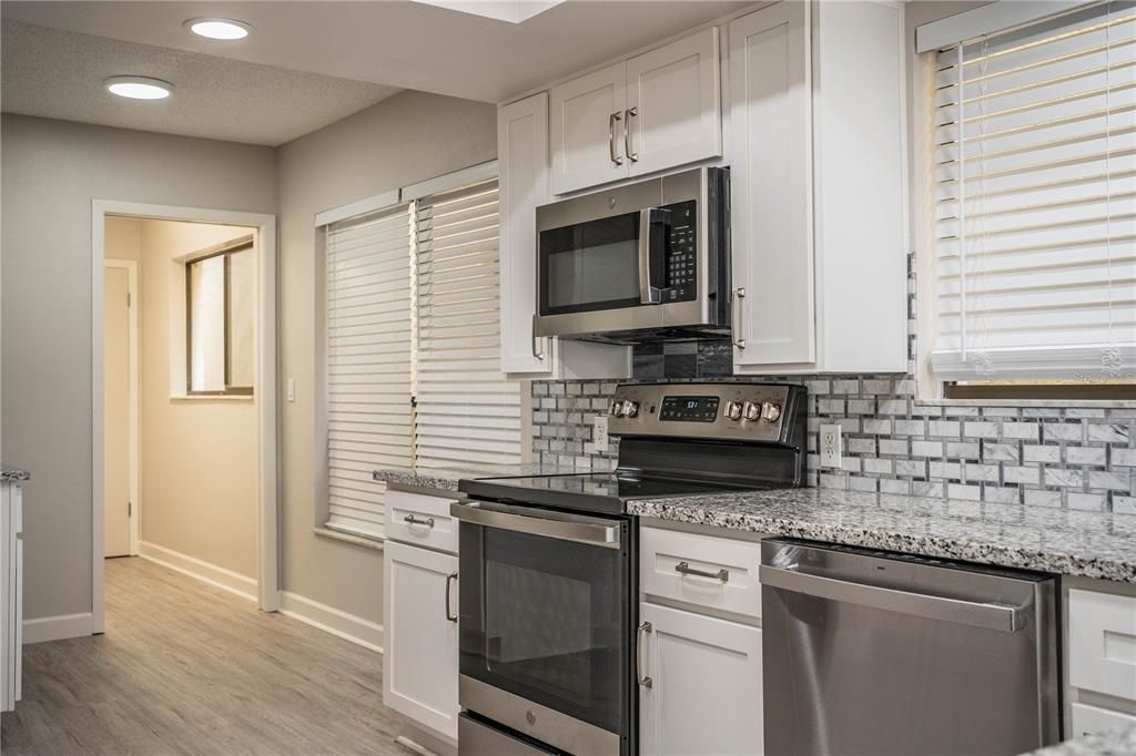 Interior, Kitchen, Recessed Lighting, Stainless Steel Appliances, Wood Texture Flooring