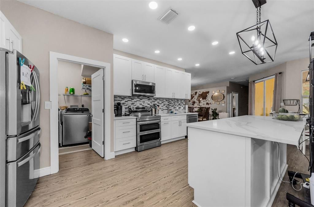 Interior, Kitchen, Pendant Lights, Recessed Lighting, Stainless Steel Appliances, Wood Texture Flooring