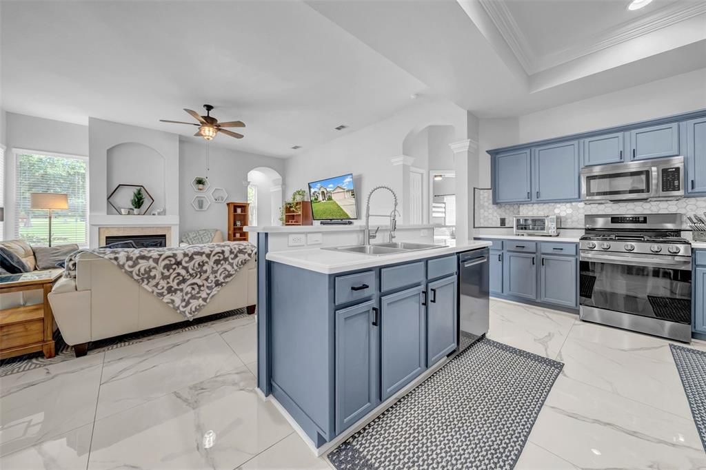 Fireplace, Interior, Kitchen, Living room, Marble, Recessed Lighting, Stainless Steel Appliances