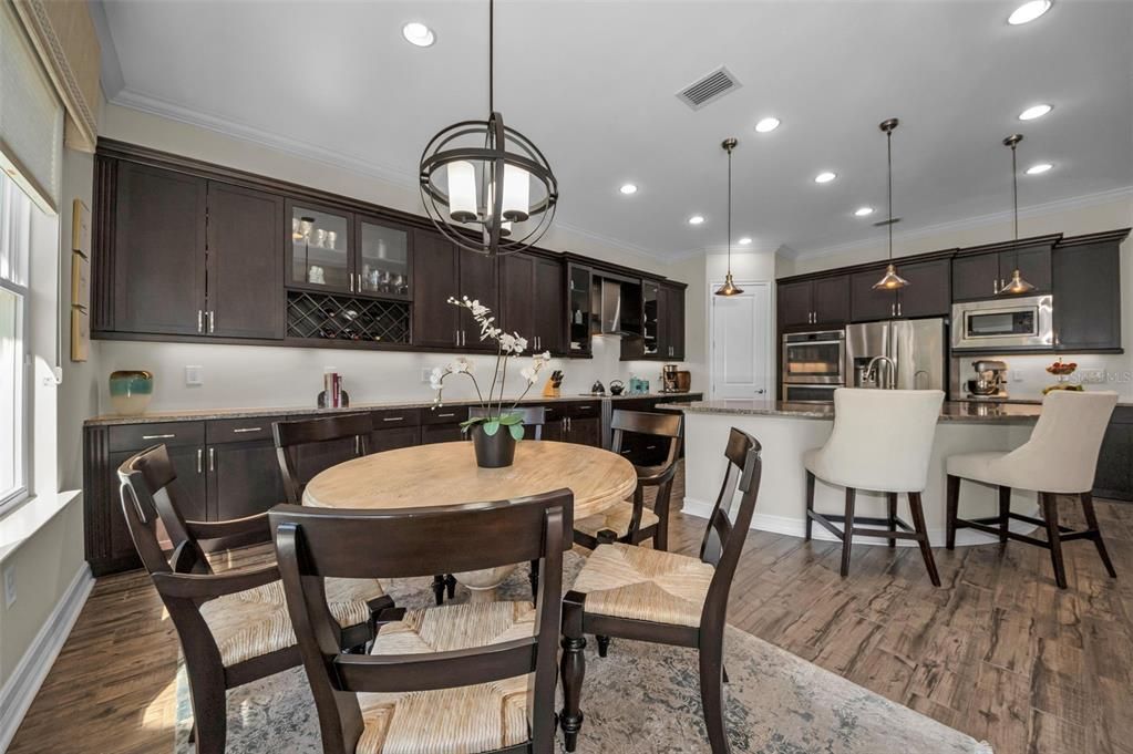 Dining room, Interior, Kitchen, Pendant Lights, Recessed Lighting, Stainless Steel Appliances, Wood Texture Flooring
