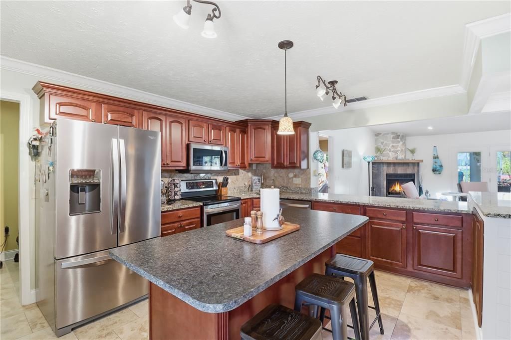 Fireplace, Interior, Kitchen, Pendant Lights, Recessed Lighting, Stainless Steel Appliances