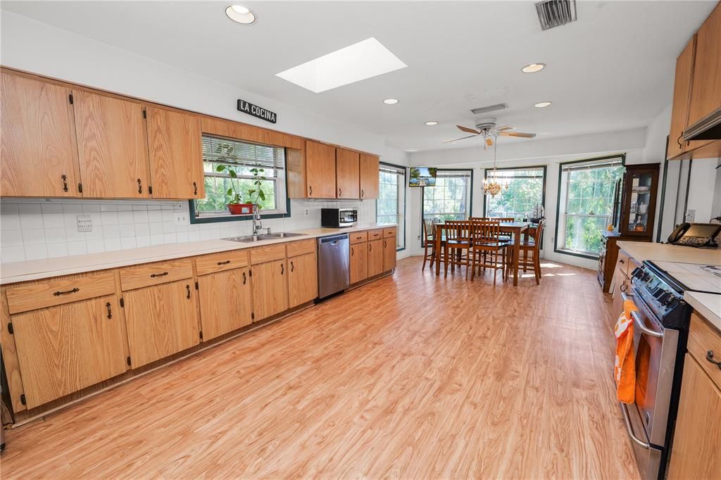Dining room, Interior, Kitchen, Recessed Lighting, Stainless Steel Appliances, Wood Texture Flooring