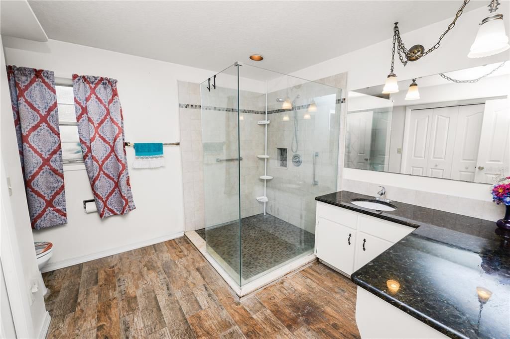 Bathroom, Glass Shower, Interior, Pendant Lights, Recessed Lighting, Wood Texture Flooring