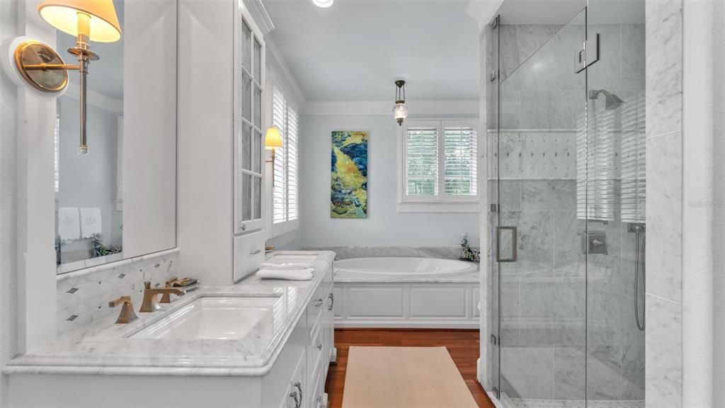 Bathroom, Dual Sink Vanities, Glass Shower, Interior, Marble Walls, Pendant Lights, Recessed Lighting, Wood Texture Flooring