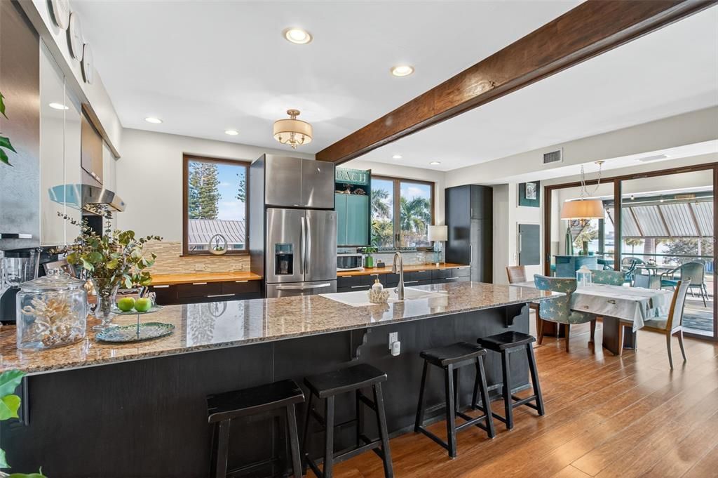 Dining room, Interior, Kitchen, Pendant Lights, Recessed Lighting, Stainless Steel Appliances, Wooden Beams, Wood Texture Flooring