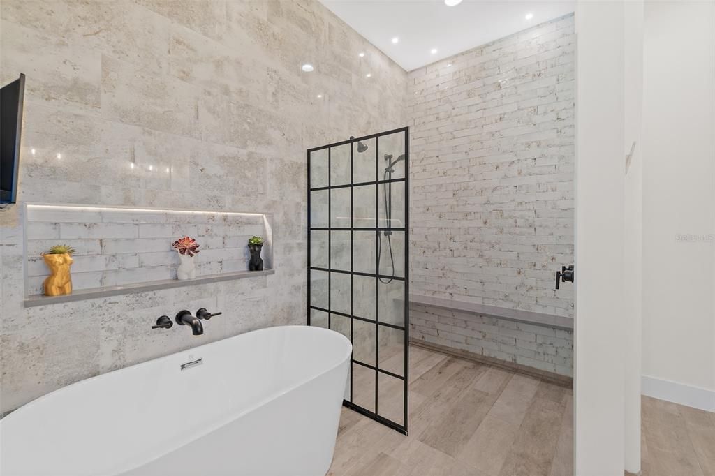 Bathroom, Free Standing Baths, Interior, Recessed Lighting, Stone Walls, Wood Texture Flooring
