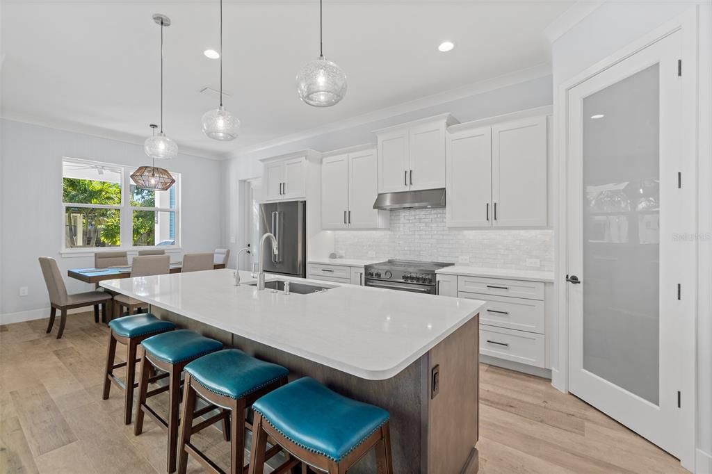 Dining room, Interior, Kitchen, Pendant Lights, Recessed Lighting, Stainless Steel Appliances, Wood Texture Flooring