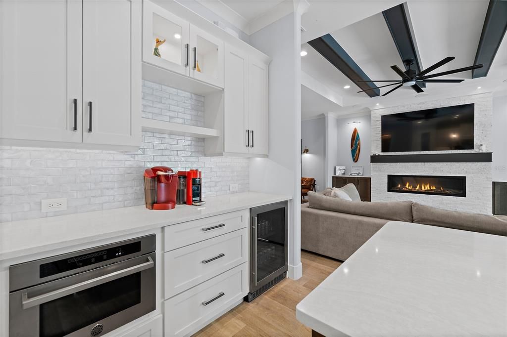 Fireplace, Interior, Kitchen, Living room, Recessed Lighting, Stainless Steel Appliances, Wood Texture Flooring