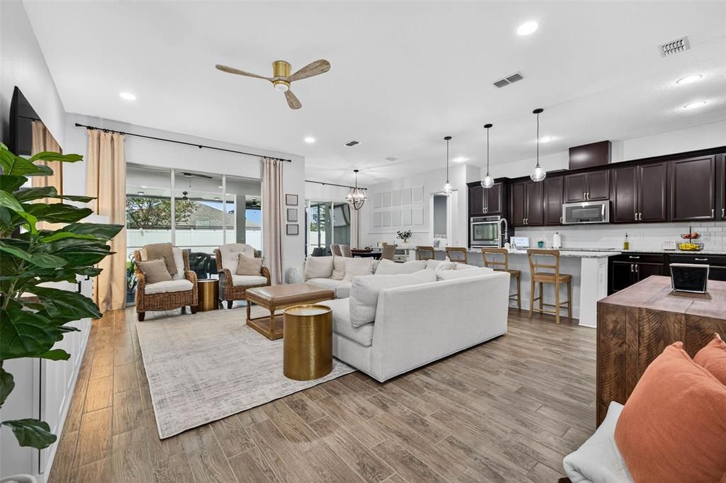 Dining room, Interior, Kitchen, Living room, Pendant Lights, Recessed Lighting, Stainless Steel Appliances, Wood Texture Flooring