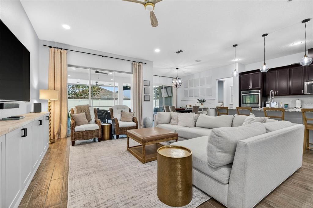 Dining room, Interior, Kitchen, Living room, Pendant Lights, Recessed Lighting, Stainless Steel Appliances, Wood Texture Flooring