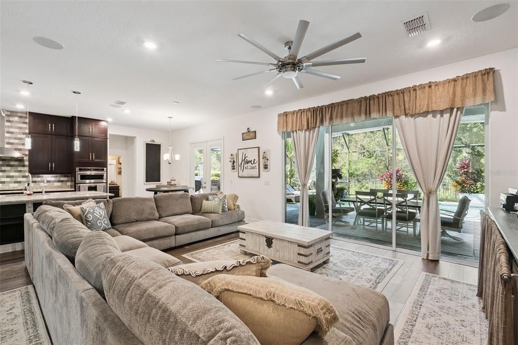 Dining room, Interior, Kitchen, Living room, Pendant Lights, Recessed Lighting, Stainless Steel Appliances, Wood Texture Flooring