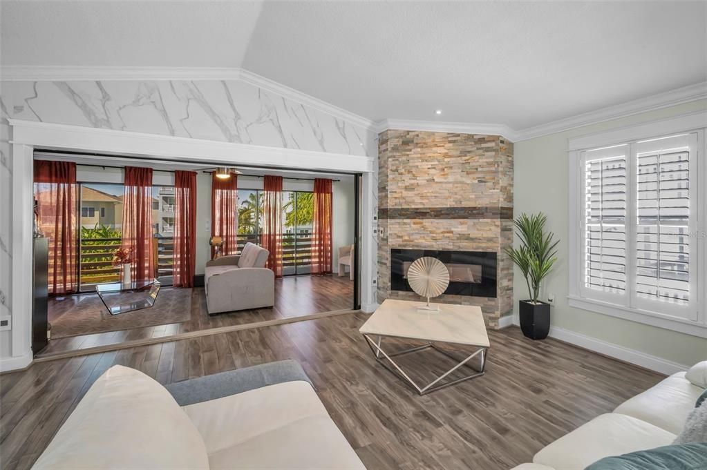 Fireplace, Interior, Living room, Marble Walls, Recessed Lighting, Stone Walls, Wood Texture Flooring