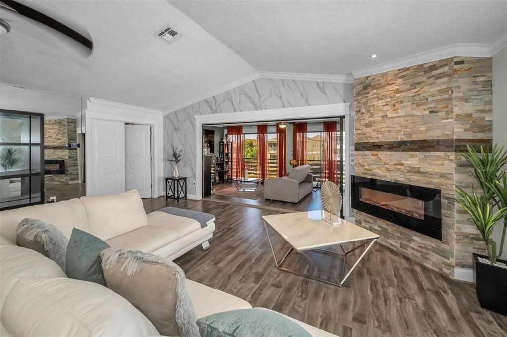 Fireplace, Interior, Living room, Recessed Lighting, Stone Walls, Wood Texture Flooring