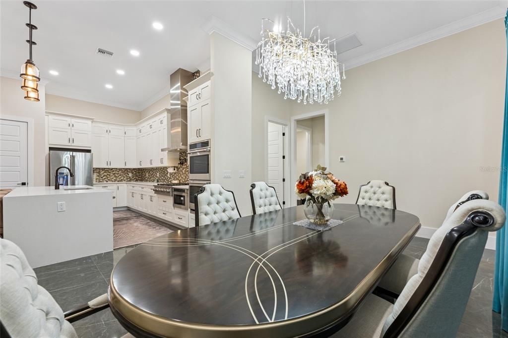 Chandelier, Dining room, Interior, Kitchen, Pendant Lights, Recessed Lighting, Stainless Steel Appliances