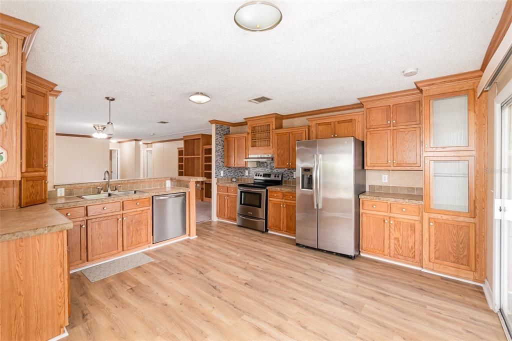 Interior, Kitchen, Pendant Lights, Stainless Steel Appliances, Tile Countertops, Wood Texture Flooring