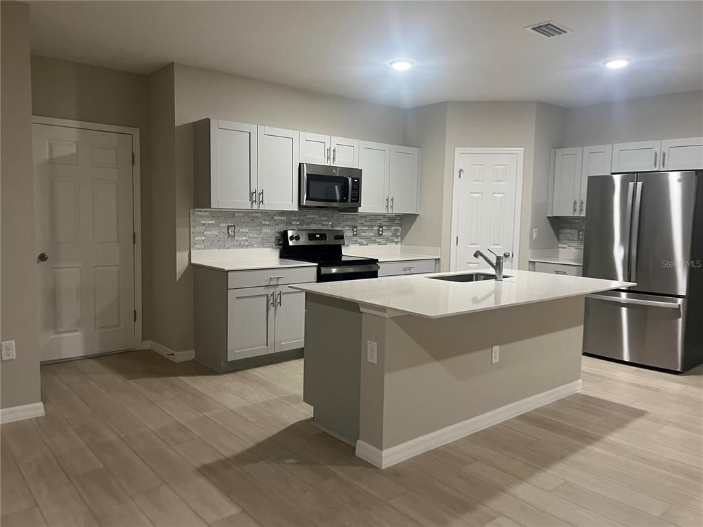 Interior, Kitchen, Recessed Lighting, Stainless Steel Appliances, Wood Texture Flooring