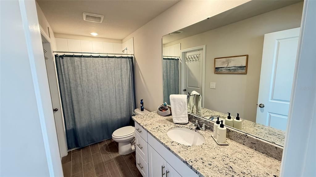 Bathroom, Dual Sink Vanities, Interior, Recessed Lighting, Wood Texture Flooring