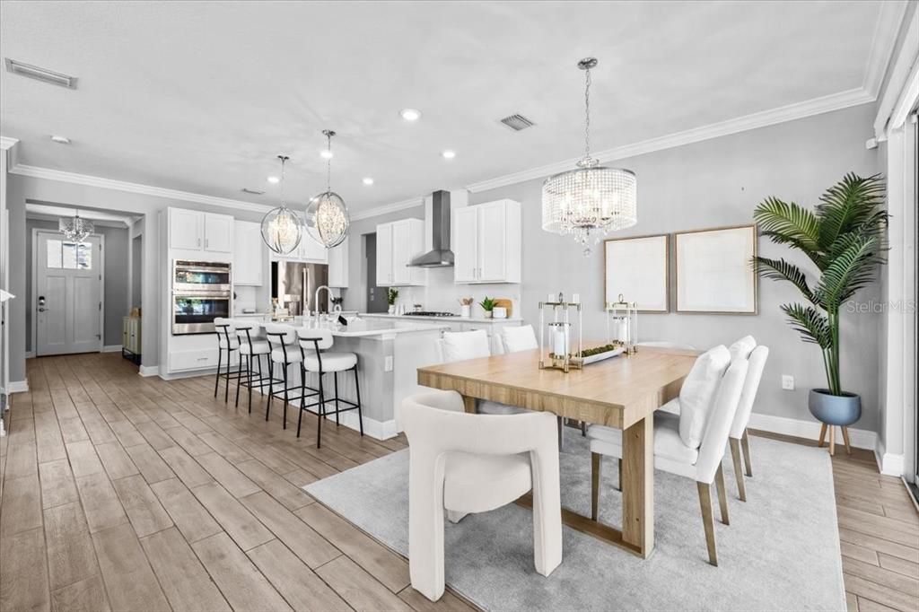 Chandelier, Dining room, Interior, Kitchen, Pendant Lights, Recessed Lighting, Stainless Steel Appliances, Wood Texture Flooring