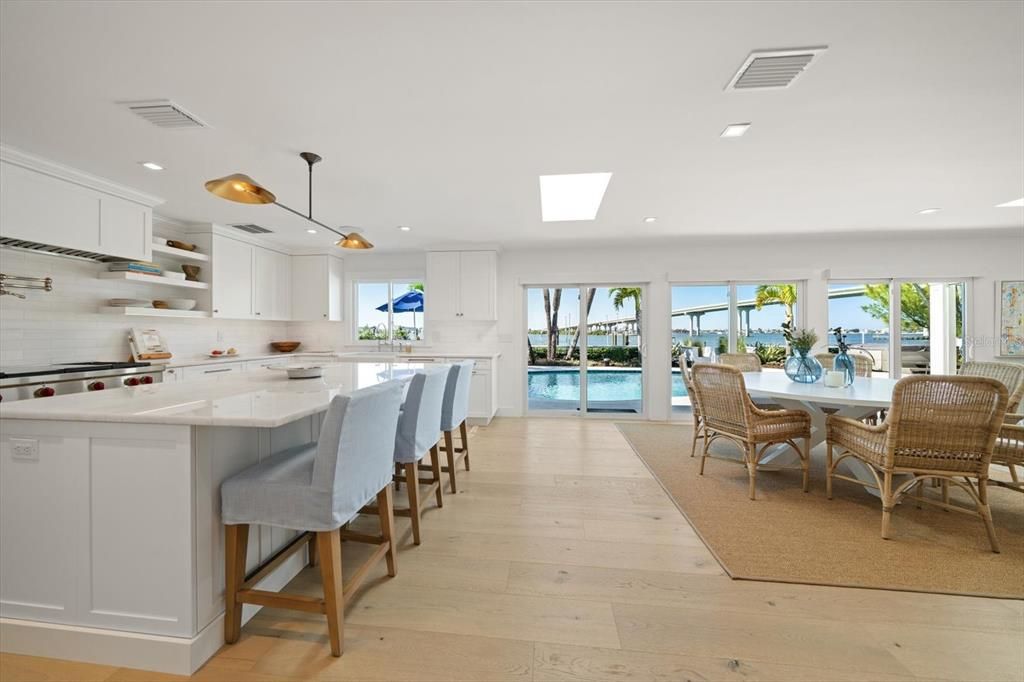 Dining room, Interior, Kitchen, Pendant Lights, Recessed Lighting, Stainless Steel Appliances, Water, Wood Texture Flooring