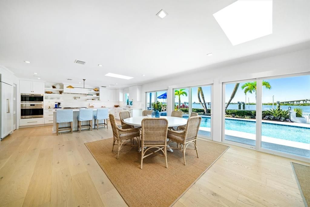 Dining room, Interior, Kitchen, Pendant Lights, Recessed Lighting, Stainless Steel Appliances, Water, Wood Texture Flooring