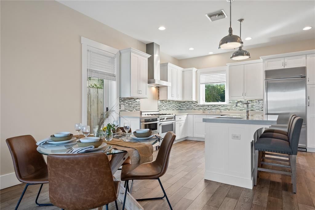 Dining room, Interior, Kitchen, Pendant Lights, Recessed Lighting, Stainless Steel Appliances, Wood Texture Flooring