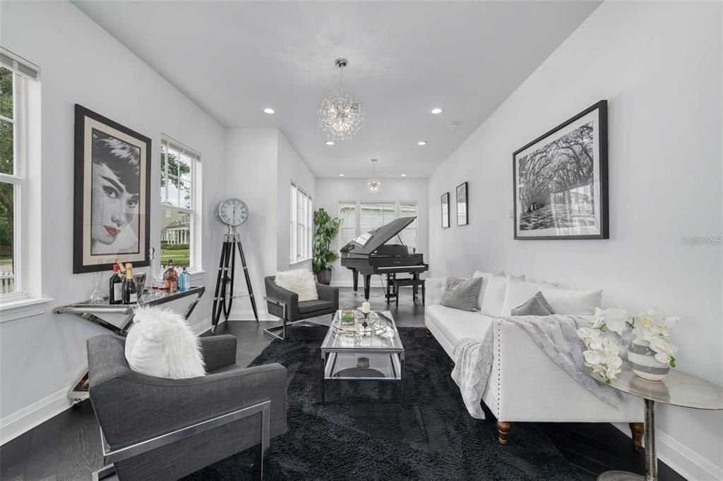 Chandelier, Interior, Living room, Piano, Recessed Lighting, Wood Texture Flooring