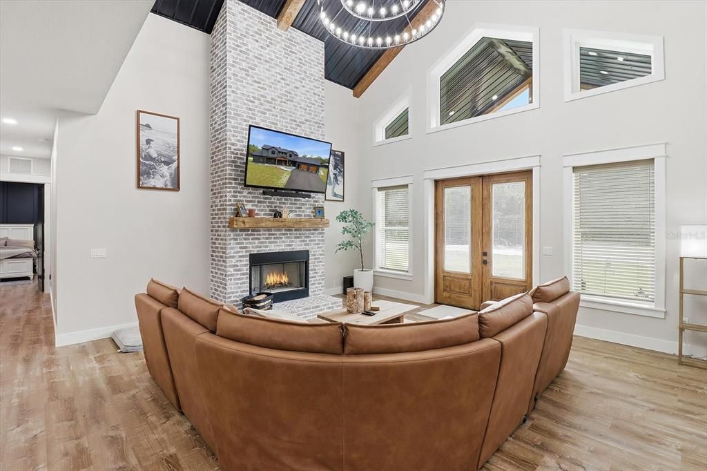 Fireplace, Interior, Living room, Pendant Lights, Recessed Lighting, Stone Walls, Wood Texture Flooring