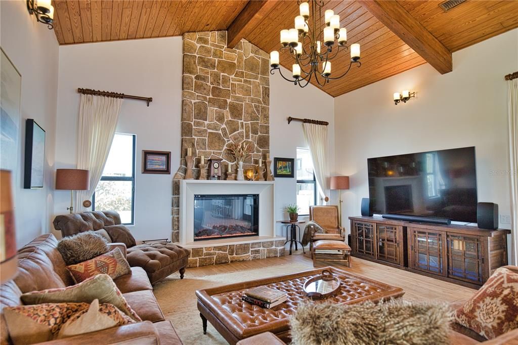 Chandelier, Fireplace, Interior, Living room, Stone Walls, Wooden Beams, Wooden Ceilings, Wood Texture Flooring