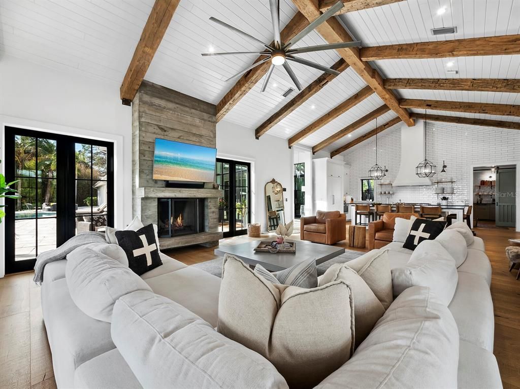 Fireplace, Interior, Living room, Pendant Lights, Recessed Lighting, Stone Walls, Wooden Beams, Wood Texture Flooring