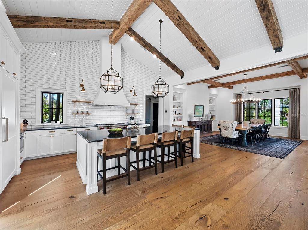 Chandelier, Dining room, Fireplace, Interior, Kitchen, Pendant Lights, Stone Walls, Wooden Beams, Wood Texture Flooring