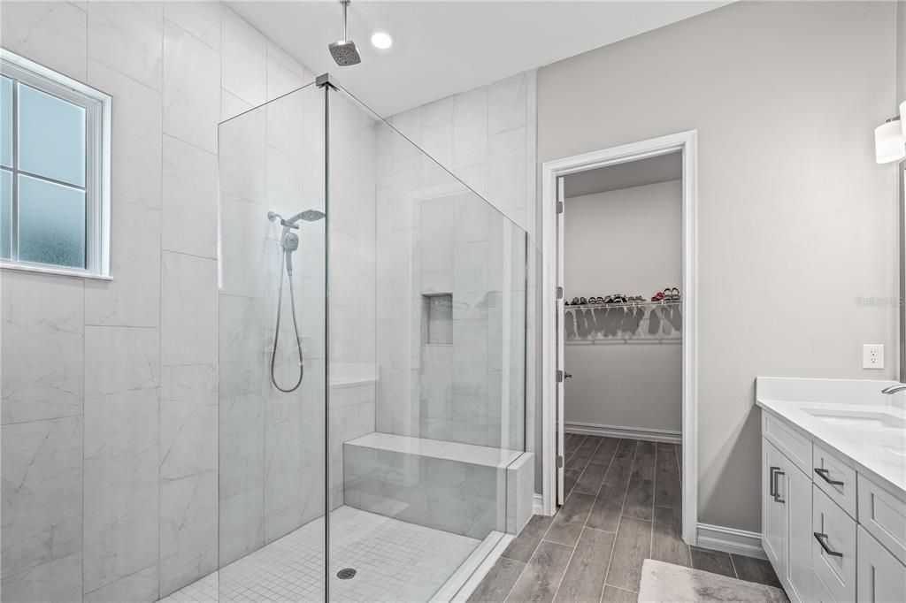 Bathroom, Glass Shower, Interior, Marble Walls, Recessed Lighting, Wood Texture Flooring