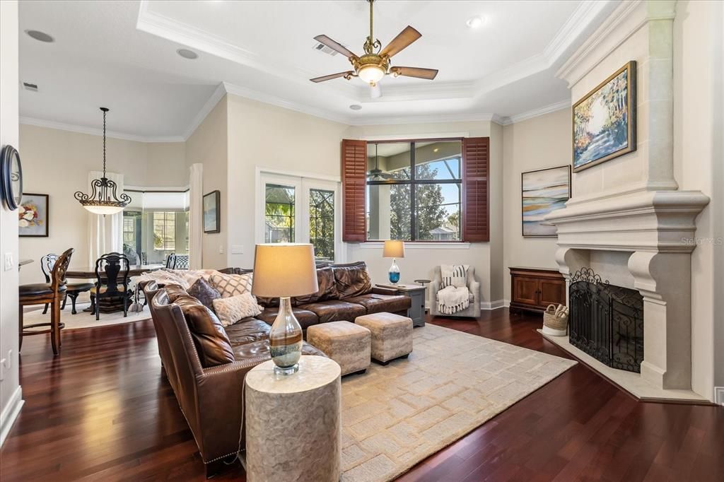 Dining room, Fireplace, Interior, Living room, Pendant Lights, Recessed Lighting, Wood Texture Flooring