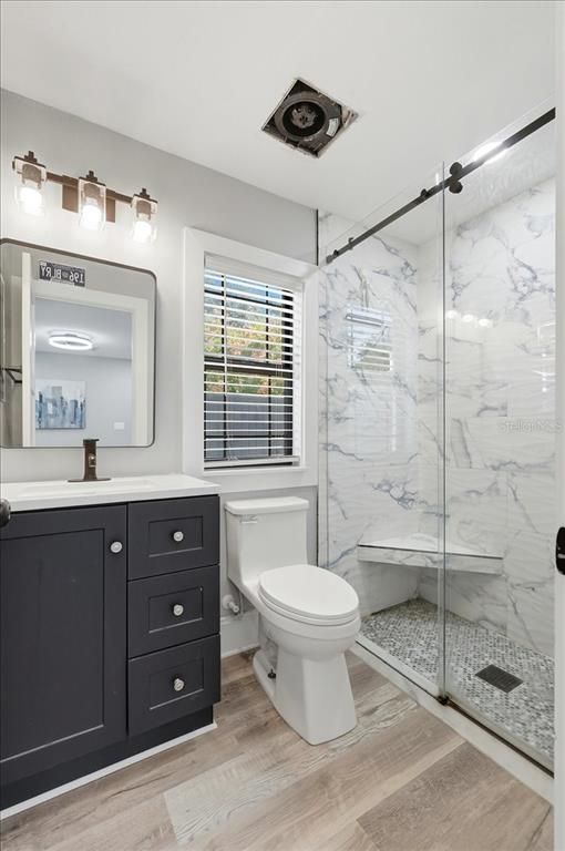 Bathroom, Glass Shower, Interior, Marble Walls, Wood Texture Flooring