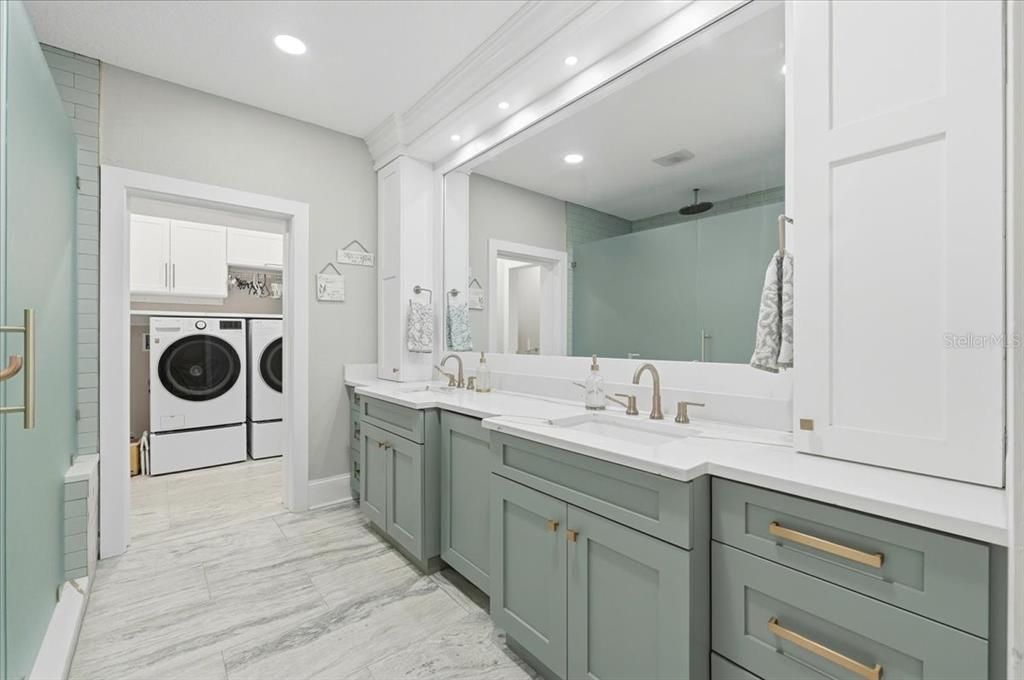 Bathroom, Dual Sink Vanities, Interior, Marble, Recessed Lighting, Washer, Wood Texture Flooring