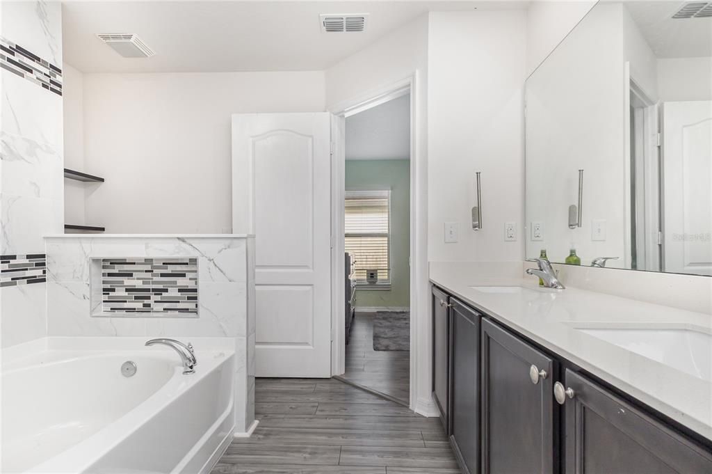 Bathroom, Dual Sink Vanities, Interior, Marble Walls, Wood Texture Flooring
