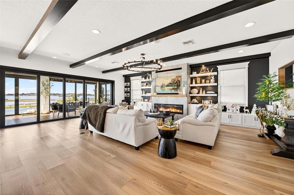 Fireplace, Interior, Living room, Pendant Lights, Recessed Lighting, Water, Wood Texture Flooring