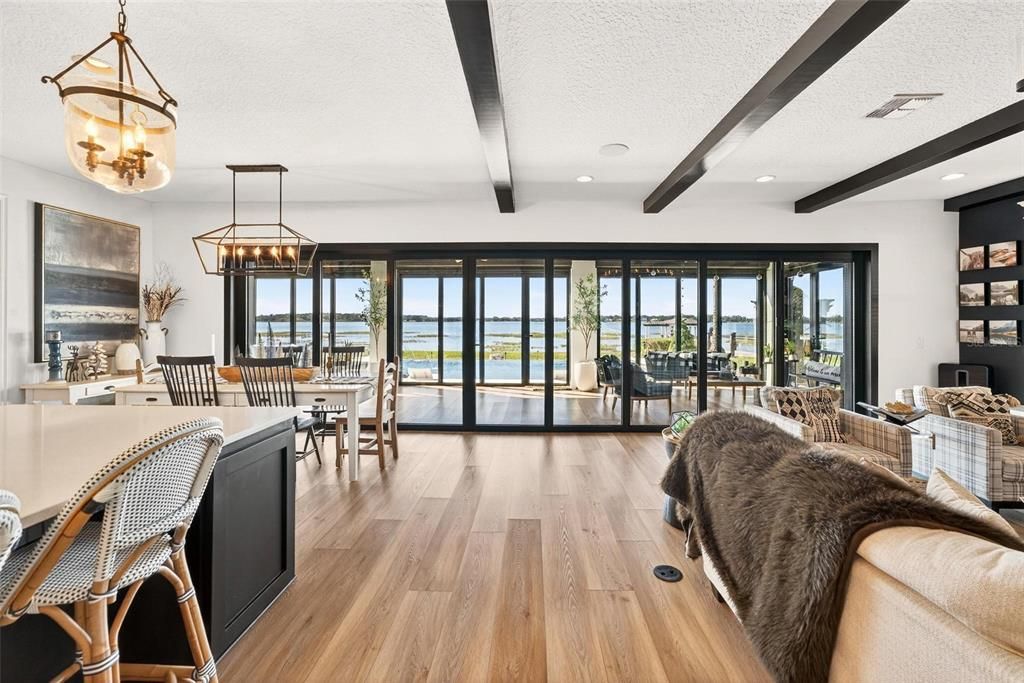 Chandelier, Dining room, Interior, Living room, Pendant Lights, Recessed Lighting, Water, Wooden Beams, Wood Texture Flooring