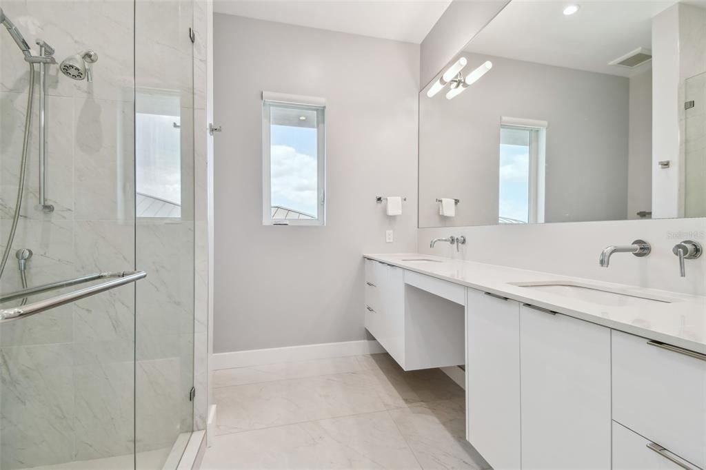 Bathroom, Dual Sink Vanities, Glass Shower, Interior, Marble Walls, Recessed Lighting