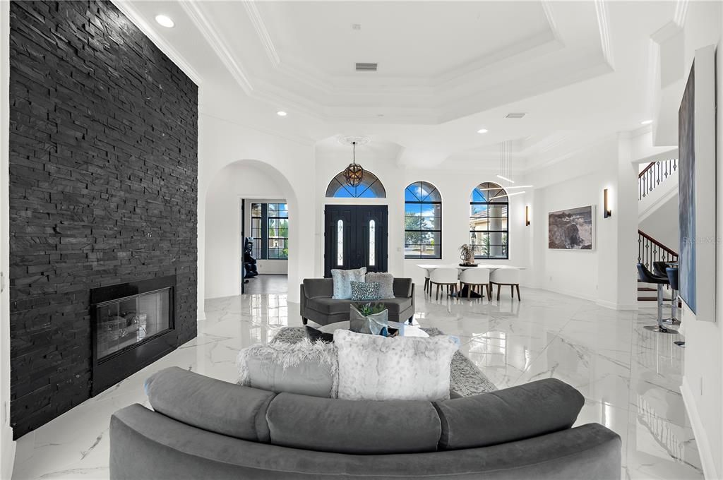 Dining room, Fireplace, Interior, Living room, Marble, Pendant Lights, Recessed Lighting, Stone Walls