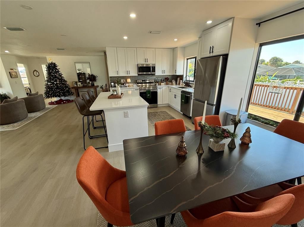 Dining room, Interior, Kitchen, Recessed Lighting, Stainless Steel Appliances, Wood Texture Flooring