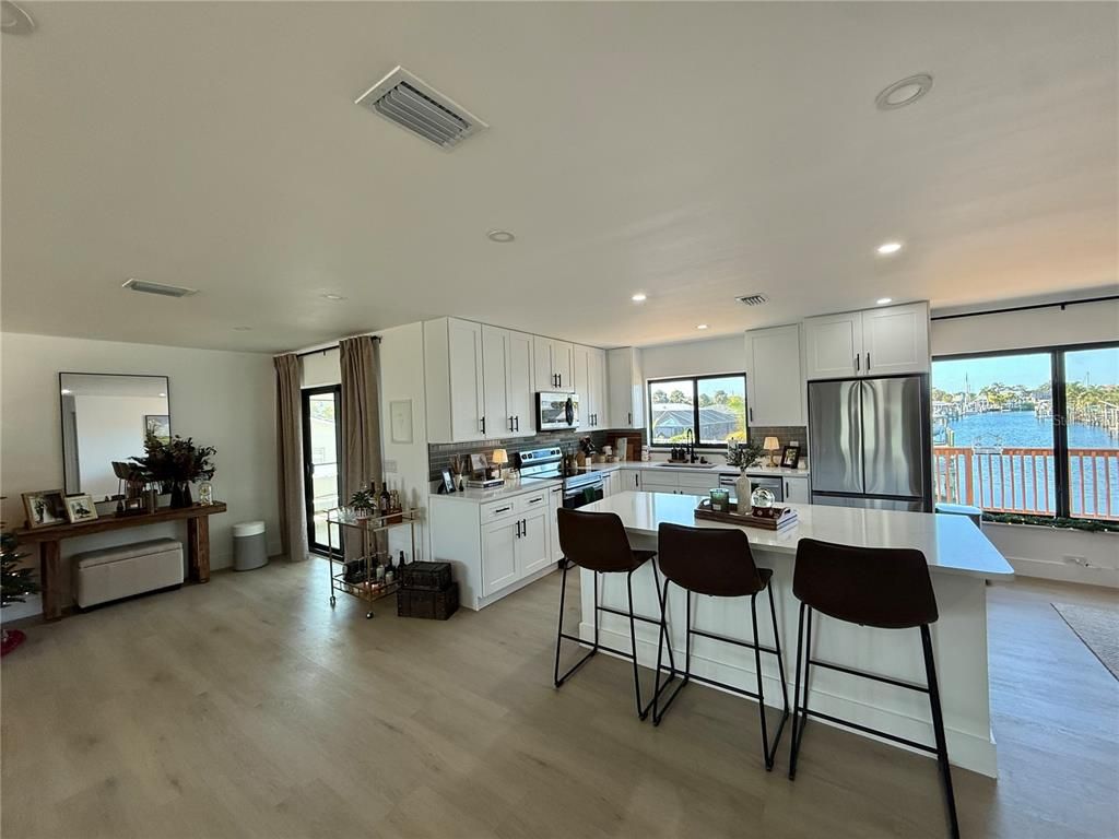 Interior, Kitchen, Recessed Lighting, Stainless Steel Appliances, Water, Wood Texture Flooring