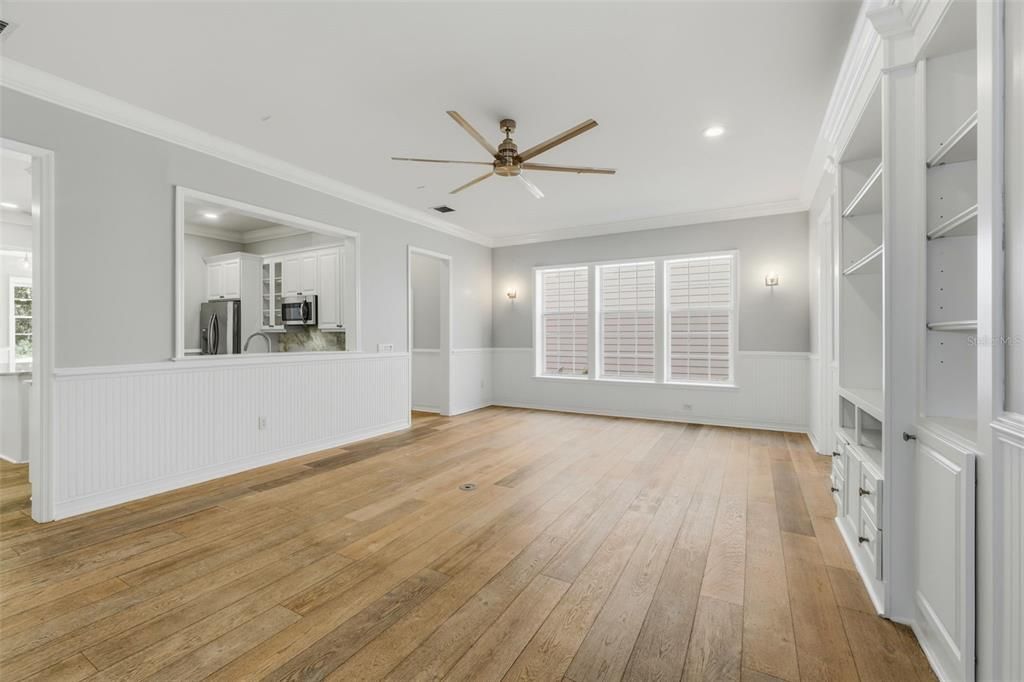 Empty room, Interior, Kitchen, Recessed Lighting, Stainless Steel Appliances, Wood Texture Flooring