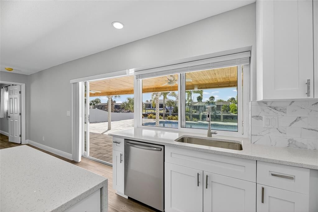 Interior, Kitchen, Marble Walls, Recessed Lighting, Water, Wood Texture Flooring