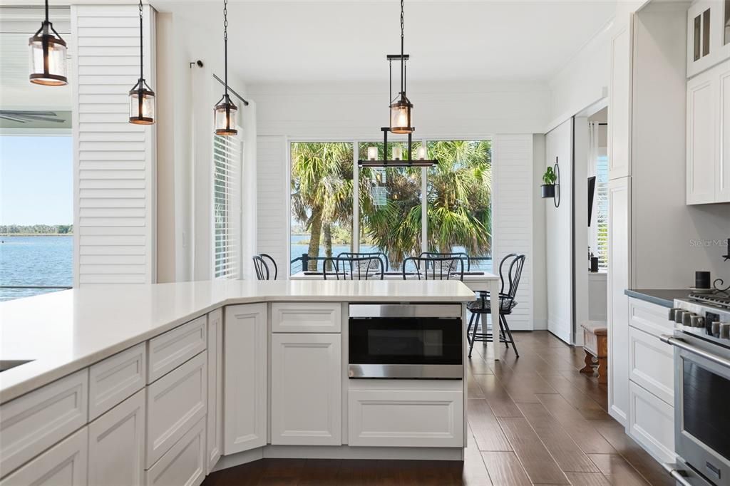 Dining room, Interior, Kitchen, Pendant Lights, Stainless Steel Appliances, Water, Wood Texture Flooring