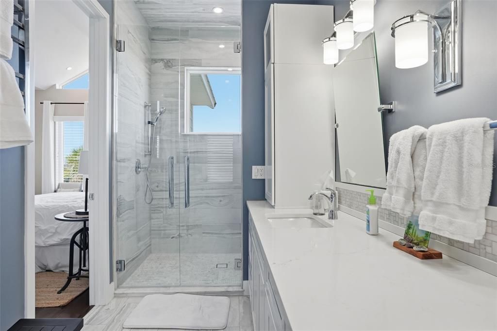 Bathroom, Dual Sink Vanities, Glass Shower, Interior, Marble, Marble Walls, Recessed Lighting
