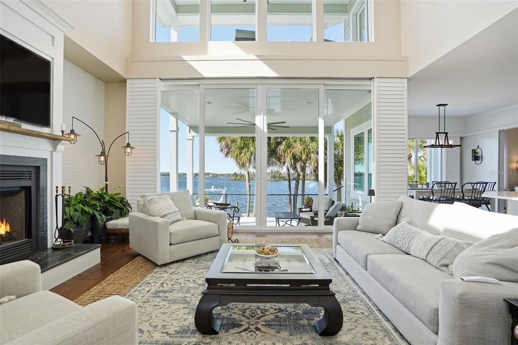 Dining room, Fireplace, Interior, Living room, Pendant Lights, Water, Wood Texture Flooring