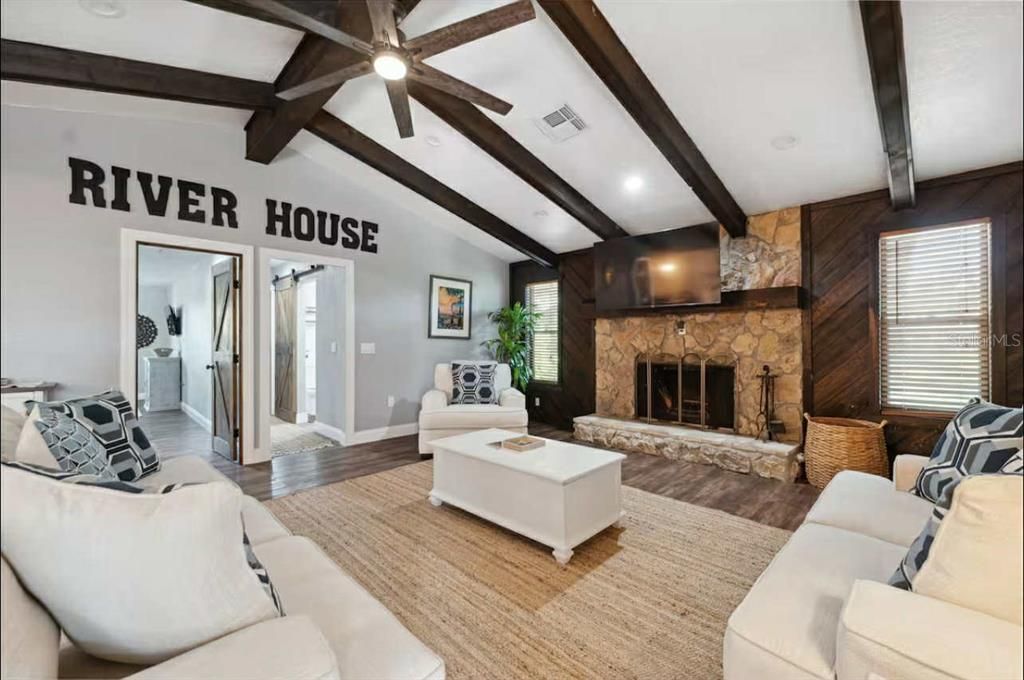 Fireplace, Interior, Living room, Recessed Lighting, Stone Walls, Wooden Beams, Wood Texture Flooring