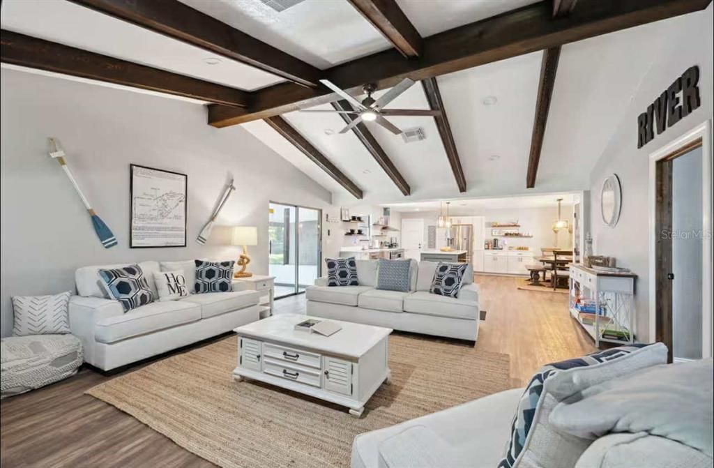 Dining room, Interior, Kitchen, Living room, Pendant Lights, Recessed Lighting, Stainless Steel Appliances, Wooden Beams, Wood Texture Flooring