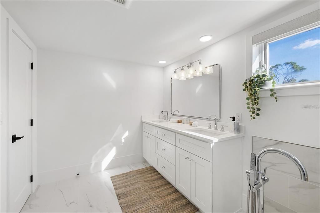 Bathroom, Dual Sink Vanities, Interior, Marble, Recessed Lighting, Wood Texture Flooring